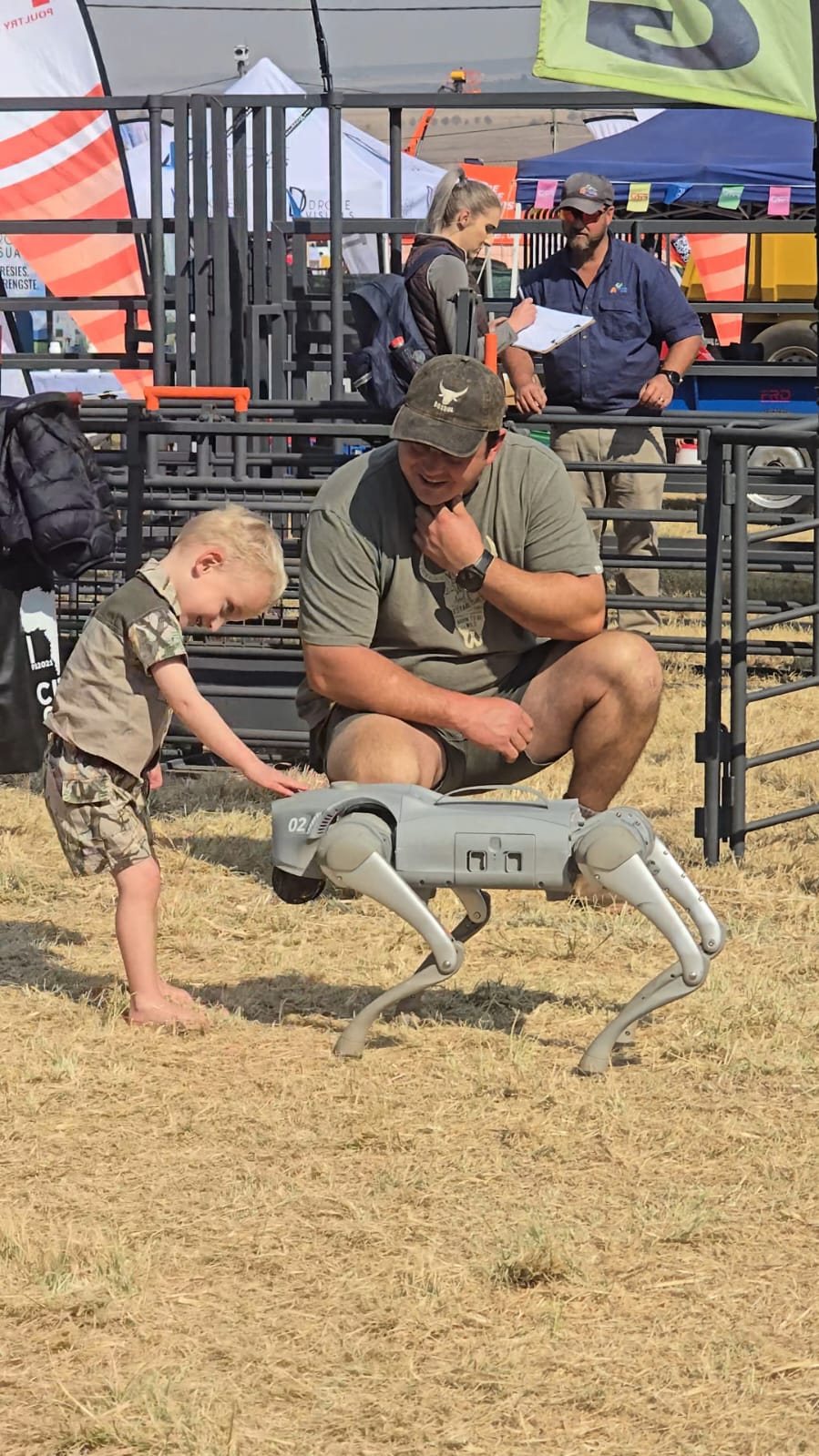 A young visitor meets a Unitree Go2 robot dog at the MCM Robotics stand, KragDag 2026